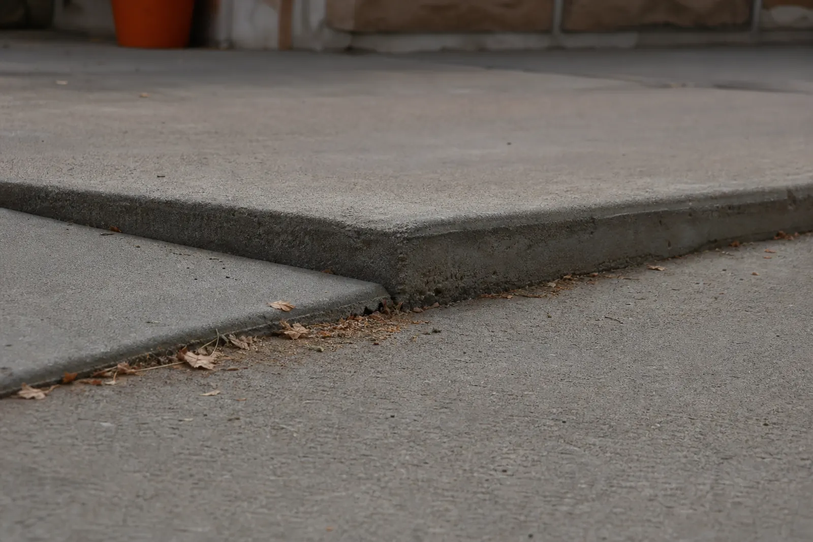 Close view of two concrete slabs meeting at different heights